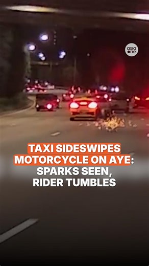 In the video posted by Facebook page SG Road Vigilante, sparks could be seen as the motorcycle fell to the ground, with the rider tumbling across almost an entire lane. Police investigations are ongoing. https://asia1.news/4plpo26 #sgnews #Singapore #Road #Taxi #Motorcycle #Accident #Police | AsiaOne
