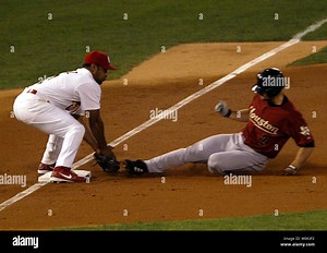 St. Louis Cardinals third baseman Abraham Nunez appears to apply a tag to Houston Astros Chris Burke but is late for a triple during the second inning of game two of the National League Championship Series in St. Louis on October 13, 2005. Houston won the game, 4-1. (UPI Photo/Bill Greenblatt Stock Photo - Alamy