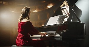 clip-3543426947-portrait-female-red-dress-sitting-black-grand