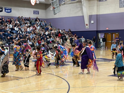Local Native American tribe performs high school basketball halftime show