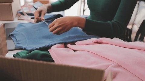 clip-3992477925-asian-beautiful-woman-sell-cloth-product-online