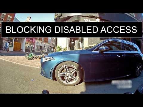 Mercedes driver blocking a dropped kerb.