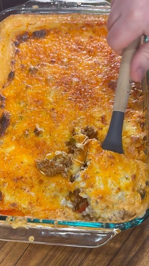 Tamale pie 2 boxes of Jiffy cornbread mix 1 cup of sour cream 2 cans of creamed corn 2 eggs 1 lb ground beef 1 lb chorizo 1 container Queso(15oz) 1/2 Chopped onion and 2 bell peppers if desired 1 can of red enchilada sauce(15-19oz) 2 cups of quesadilla cheese 1 cup of sharp cheddar Taco seasoning Whisk together the cornbread mix, sour cream, corn and eggs. Spread it into a greased 9 x 13 baking dish. Bake at 400 for 30-35 mins. Cook down peppers/onions for 6-7 min on medium heat. Add ground beef