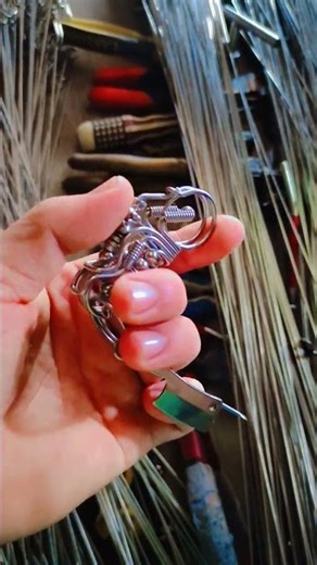 Handmade skull keychain in motorcycle style, a unique artistic gift with a mechanical carabiner hook