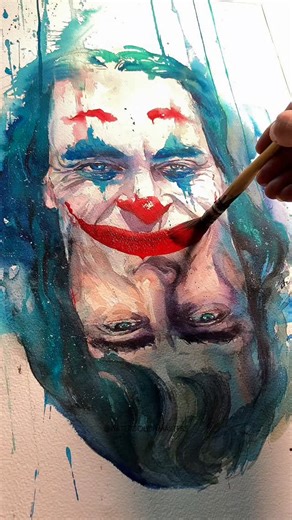Watercolor Art Gallery on Instagram: "Watercolor portrait painting by artist Xiye (Douyin) — a powerful and emotionally charged depiction brought to life with fluid washes and expressive brushwork. The bold contrasts, dripping pigments, and raw color choices create a haunting intensity, blurring the line between vulnerability and chaos while showcasing the dramatic potential of watercolor. Artist: Xiye (Douyin) #watercolorpainting #portraitart #jokermovie #watercolorartist #joker"
