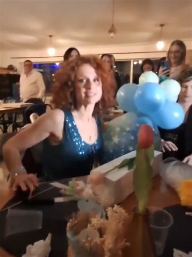 Beatrice Luzzi Celebrates with Balloon Popping