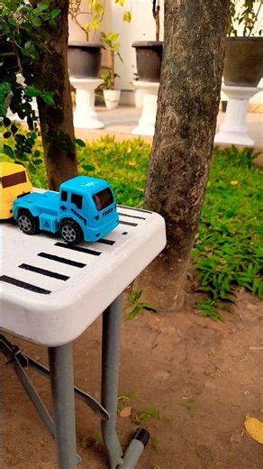 Monster jump pushing blue truck and yellow truck