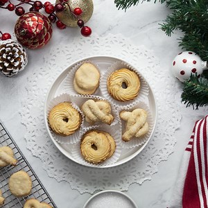 2.4M views · 1K reactions | A Christmas classic you’ll love making at home. These crispy butter cookies come in different shapes, and textures including shredded coconut and a pretzel shaped topped with crunchy sparkling sugar. | Tasty | Facebook