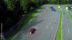 Test drive when a red car is driving between the bollards and then it hits a car
