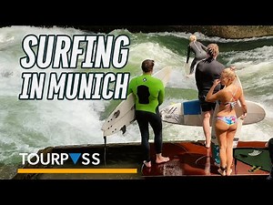 River Surfing in Munich City Center on the Eisbach standing wave (4K Ultra HD Travel Video) Munchen