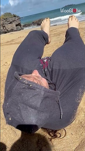 Hilarious beach dance fail leaves woman awkwardly stuck in jumper || WooGlobe