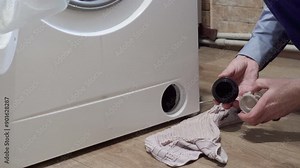 installing a filter in the washing machine, the plumber cleaned the dirty filter in the washing machine and installed it in place