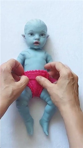 Dressing an 11 Inch Fantasy Silicone Baby with a Tail Outfit