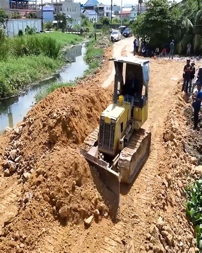 2.4K views · 21 reactions | A well-executed technique to build a new road across water — dump trucks unloading soil into the water while a dozer pushes and levels the fill-1 | Excavator Bulldozer | Facebook