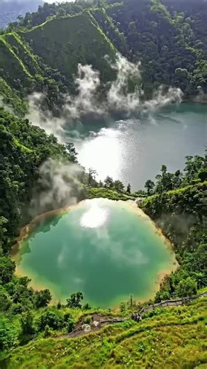 The magical colors of Telaga Warna Dieng 🌈✨ Hidden in the highlands of Dieng Plateau, this stunning lake is famous for its changing colors caused by natural minerals beneath the water. Surrounded by misty hills and cool mountain air, it’s one of the most unique natural wonders in Central Java, Indonesia. A lake that changes colors like magic — nature’s masterpiece waiting to be explored. Would you visit this hidden gem? 🌿💧 #TelagaWarna #DiengPlateau #CentralJava #IndonesiaNature #HiddenGem