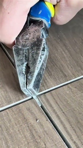 Power tool clears grout—hidden renovation craft revealed in flawless tile line precision…