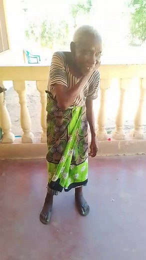 Elderly Woman Engages in Porch Conversation