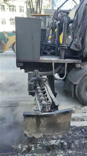 Liquid asphalt spraying on road surface #video