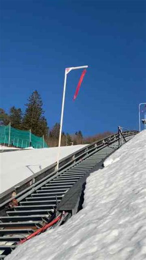 Thrilling Ski Jump from a Steep Snowy Ramp