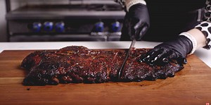 Chef Britt celebrates one year at All Things BBQ by smokin' up a batch of ribs chock full of honey and garlic flavor! She shows you the basic techniques of preparing these smoked ribs using incredible seasoning and caramelizing garlic along the way! Full recipe here: https://www.atbbq.com/thesauce/honey-... | All Things Barbecue