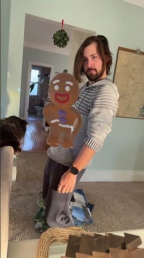 Festive Fun: Man Dances with Animated Gingerbread Man#HolidayFun #GingerbreadMan