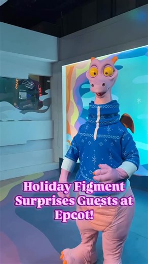 Figment surprised guests this morning at his Imagination pavilion meeting and greet! He showed up wearing a holiday sweater. But strangely, it looks very different than the one he wears on Journey Into Imagination. #imagination #figment #epcotfestivaloftheholidays #figmentsweater What do you think of Figment wearing a sweater for his meet and greet? Let us know in the comments. | WDW News Today