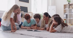 Happy school teen friends group study at home lesson with teacher, fellow people having class, students reunion, school club team community mates meeting, teenagers together enjoy learning at floor