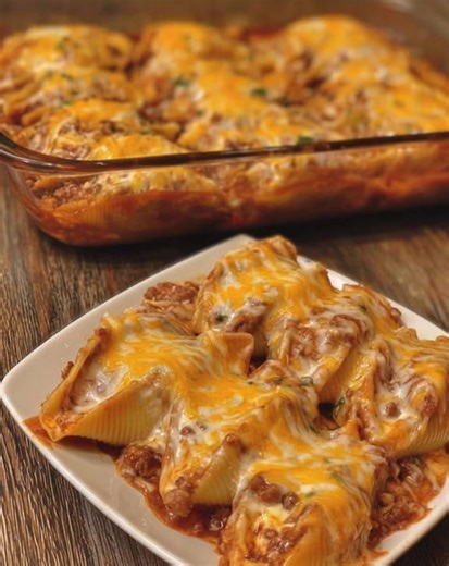 🌮🧀 Taco-Stuffed Pasta Shells A Cheesy Taco Night Upgrade 💛 Jumbo pasta shells stuffed with seasoned ground beef, creamy cream cheese, and zesty salsa, then baked under a blanket of melted taco-blend cheese. This fun, comforting casserole brings together everything you love about taco night with cozy baked-pasta vibes—perfect for family dinners, potlucks, or anytime you want a bold, satisfying twist on classic tacos. Ingredients • 8 oz jumbo pasta shells • 1 lb ground beef • 1 packet taco seas