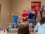 Young boy does hilarious dance amid school show