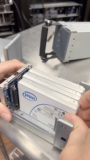 We had this beautiful beast running 41GB/s Vision AI object recognition Doom server with 8 AI players all running at the same time in the Solidigm booth at FMS this week. Before we shipped the server to Santa Clara, here’s Kevin prepping the 120TB of storage that gets routed to 3x Adaptec NVMe RAID cards. #storage #ssd #datacenter #ai #datacenter #computers | StorageReview