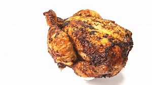 clip-3446624699-whole-roast-chicken-rotating-isolated-on-white