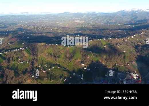 Aerial view of scattered village houses on hilly Anatolian landscape in Trabzon Turkey. Green slopes and winding roads reveal rural settlement patterns across eastern Blacksea region hills Stock Video Footage - Alamy