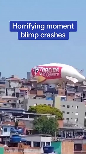 This is the moment a blimp crashed into a row of houses, injuring one person. The airship was rented by Brazilian soccer team São Paulo FC for a promotion and was performing a test flight when it suddenly plummeted. Footage showed the blimp on top of the homes as curious residents rushed out of their homes. The pilot, whose name has not been released, was rescued from the cabin and taken to a local hospital. Authorities have not said if any people were inside the homes at the time of the acciden