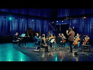 A world made of one dimensional strings that twist, fold and vibrate.