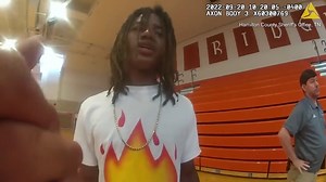 Moment officer grabs student by neck and drags him down bleachers