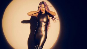 Rita Ora reveals new pink hair as she poses in 'glitterball' two-piece