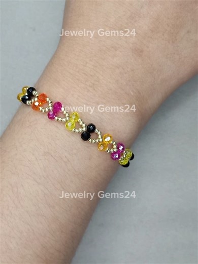 Bracelet Making #JewelryGems24 #bracelet #bracelets #jewelry #foryou Materials: 1. Orange crystal beads 4mm 2. Yellow crystal beads 4mm 3. Pink purple crystal beads 4mm 4. Black crystal beads 4mm 5. Gold seed beads 11/0 6. Beading needles number 11 & thread 👉 Thread length: 120cm