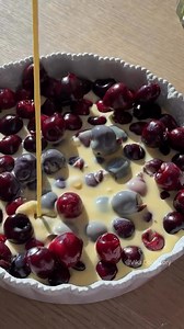 Clafoutis 📍 France 🇫🇷 Explore France: tasteatlas.com/france A rustic French dessert from the Limousin region, clafoutis is made by baking black cherries in a thick, eggy batter similar to crêpe mix. Traditionally, the cherries are left unpitted to enhance flavor with their almond-like kernels. Once baked, the clafoutis is dusted with powdered sugar and served warm or at room temperature. Though the classic version uses cherries, variations with other fruits (like plums or apricots) are techni