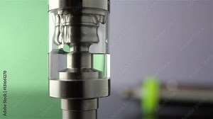 Filling of a tank for an electronic cigarette liquid close up. Rebuildable dripping atomizer (RDA). Electronic nicotine delivery systems. ENDS.
