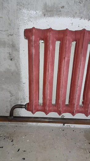 Red Radiator Mounted on Wall: Interior Design Idea