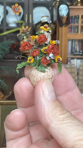 2.7K views · 200 reactions | Fall flower arrangement  (unidentified artist). Can anyone identify these flower types? The arrangement is in what appears to be a cork-like vase. It’s got a matt finish and texture and I don’t think it’s clay pottery. Hmmmm any ideas? #fall #fallcolors #fallvibes #dollhouse #dollhouseminiatures #miniatures #miniatureflowers #tinythings #flowers #fallfolliage | D. Thomas Miniatures | Facebook