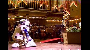 A long time ago (1980) in a galaxy (not so) far far away, John Williams conducted his first Boston Pops performance alongside his trusty sidekicks, C-3PO and R2-D2. The man, the myth, the legend debuts his new violin concerto as well as dusts off some of his Star Wars classics as part of a new Great Performances l PBS special tonight at 9 p.m. ET on GBH-2: to.pbs.org/3C6hyjX | GBH