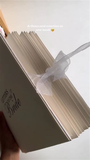 @the.art.diaryy on Instagram: "A book she’ll read today, tomorrow & forever 🥹 (DM to order) . . ( letter to the bride book) #handmade #bridebook #weddingscrapbook #bridesmaids #diy"