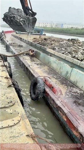 Excavator Dredging Silt from a Waterway to Ensure Safe Boat Passage