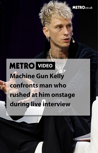 Machine Gun Kelly was met with an unexpected visitor after an eager fan stormed the stage during a live interview. The musician was caught on video jumping to his feet in shock, yelling: ‘Get the f*** away from me’ as the man went towards him. Fans have praised the musician for his speedy and mature response whilst the fan was being dragged away by security. | Metro