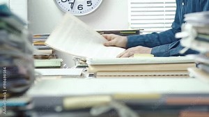 Employee working in the office and piles of paperwork Stock Video