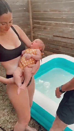 first time in the pool. she’s VERY unsure 😂 #babiesoftiktok #tiktokbabies #inflatablepool #babyswimming