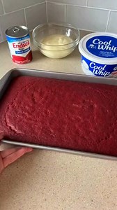 4-Ingredient Red Velvet Cool Whip Chill Cake Velvety Crimson Cloud Red Velvet Chill Cake Ingredients: 1 box red velvet cake mix (prepared and baked according to package directions) 1 can sweetened condensed milk (14 oz) 1 tub Cool Whip, thawed (8 oz) 1 cup white chocolate chips, melted Directions: Bake the red velvet cake in a 9×13-inch pan according to the package directions. Let cool for 10 minutes. Using the handle of a wooden spoon, poke holes evenly all over the cake, spacing about 1 inch a