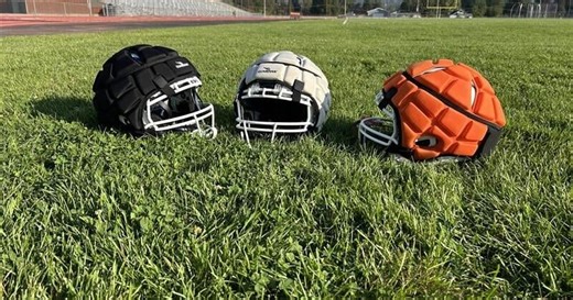 High school football teams adopt Guardian Caps despite mixed research on concussion prevention