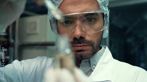 Scientist test CBD hemp oil product in curative CBD lab . The hemp oil contain natural cbd extraction from organic hemp in the farm .